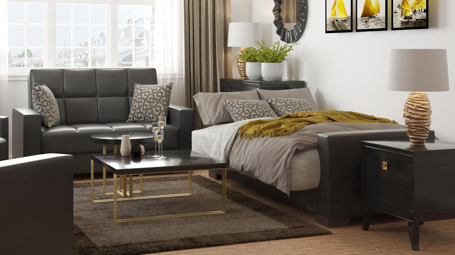 Modern design, Black , Artificial Leather upholstered convertible sleeper Loveseat with underseat storage from Voyage Track by Ottomanson in living room lifestyle setting converted to sleeper. This Loveseat measures 67 inches width by 36 inches depth by 41 inches height.