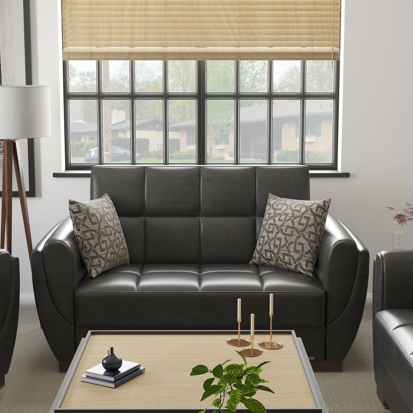 Modern design, Black , Artificial Leather upholstered convertible sleeper Loveseat with underseat storage from Voyage Shelter by Ottomanson in living room lifestyle setting by itself. This Loveseat measures 71 inches width by 36 inches depth by 41 inches height.