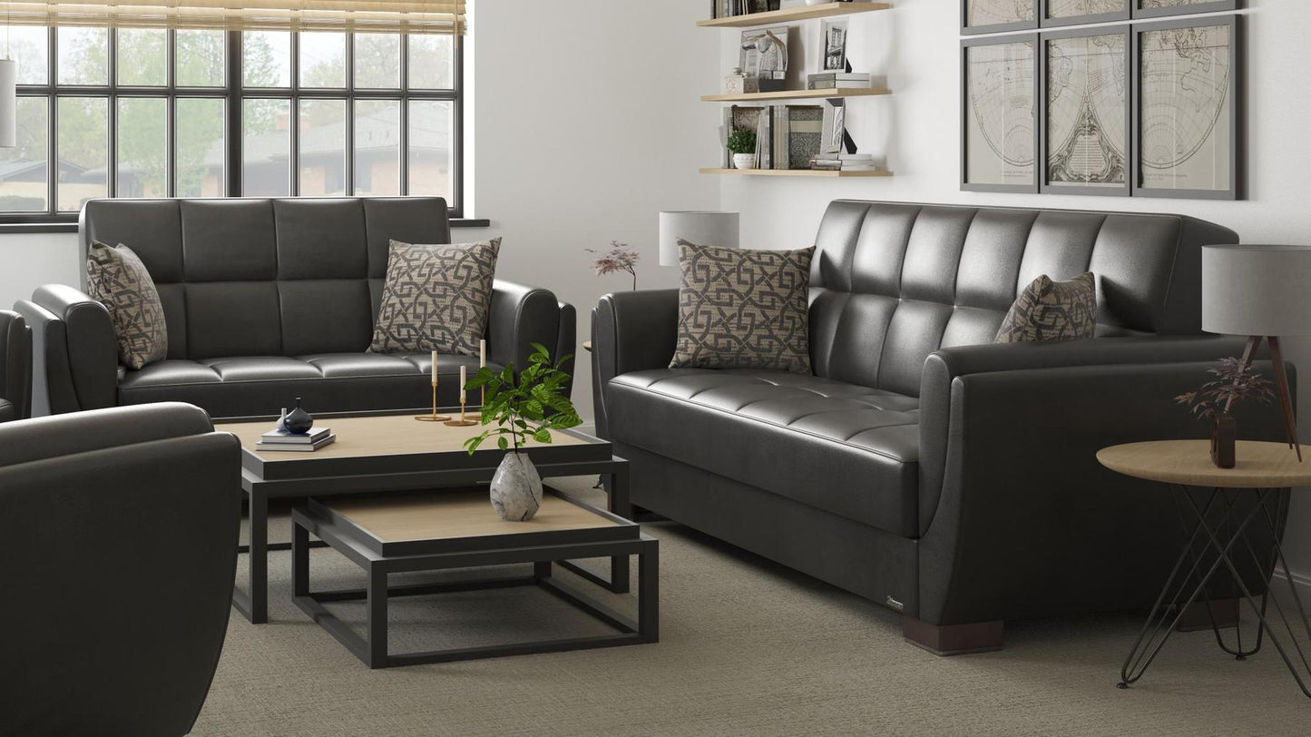 Modern design, Black , Artificial Leather upholstered convertible sleeper Loveseat with underseat storage from Voyage Shelter by Ottomanson in living room lifestyle setting with another piece of furniture. This Loveseat measures 71 inches width by 36 inches depth by 41 inches height.