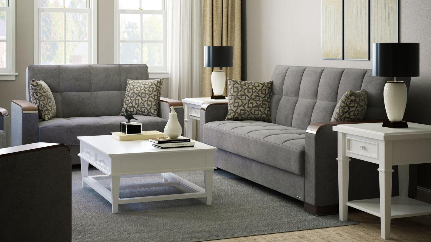 Modern design, Pewter Gray , Microfiber upholstered convertible sleeper Loveseat with underseat storage from Voyage Luxe by Ottomanson in living room lifestyle setting with another piece of furniture. This Loveseat measures 67 inches width by 36 inches depth by 41 inches height.