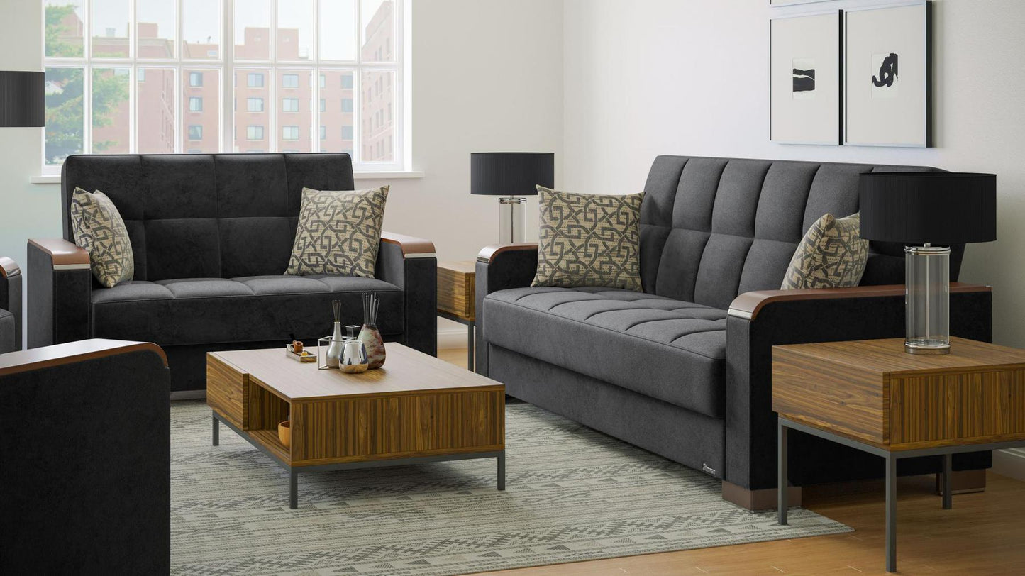 Modern design, Black , Microfiber upholstered convertible sleeper Loveseat with underseat storage from Voyage Luxe by Ottomanson in living room lifestyle setting with another piece of furniture. This Loveseat measures 67 inches width by 36 inches depth by 41 inches height.