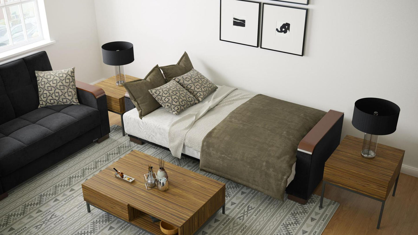 Modern design, Black , Microfiber upholstered convertible sleeper Sofabed with underseat storage from Voyage Luxe by Ottomanson in living room lifestyle setting converted to sleeper. This Sofabed measures 90 inches width by 36 inches depth by 41 inches height.