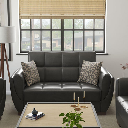 Modern design, Black , Artificial Leather upholstered convertible sleeper Loveseat with underseat storage from Voyage Shelter by Ottomanson in living room lifestyle setting by itself. This Loveseat measures 71 inches width by 36 inches depth by 41 inches height.