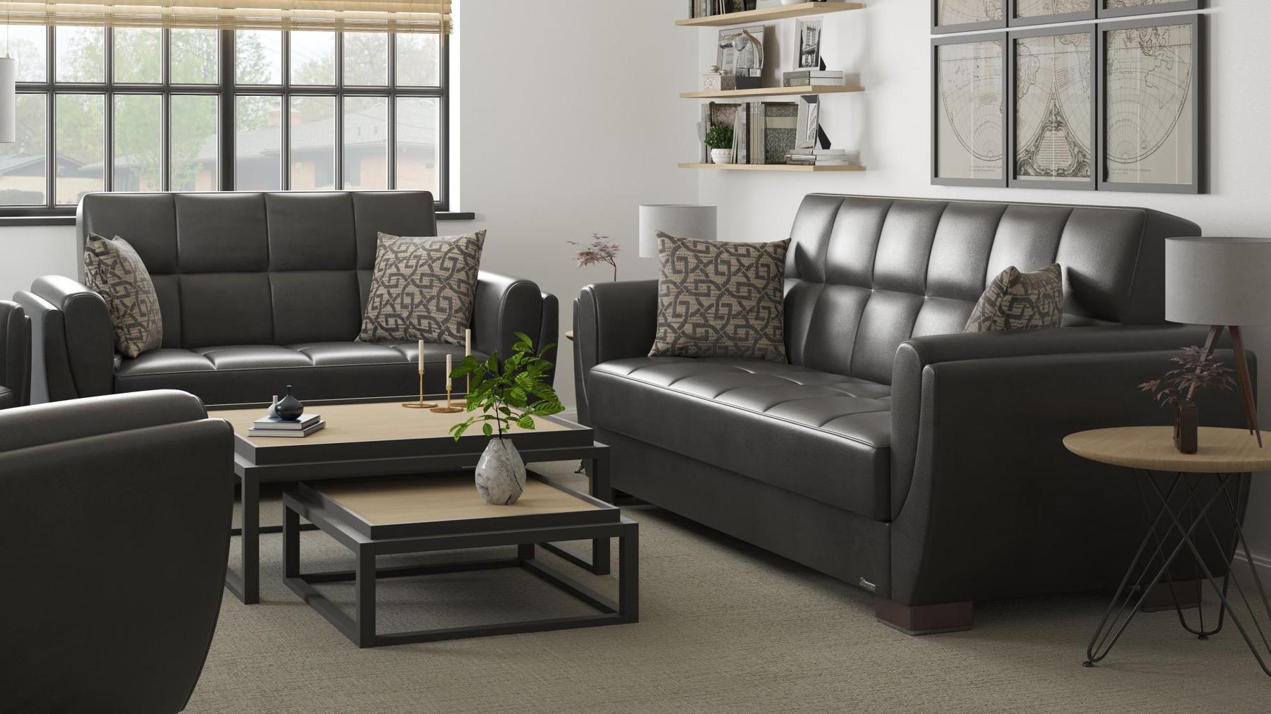 Modern design, Black , Artificial Leather upholstered convertible sleeper Loveseat with underseat storage from Voyage Shelter by Ottomanson in living room lifestyle setting with another piece of furniture. This Loveseat measures 71 inches width by 36 inches depth by 41 inches height.